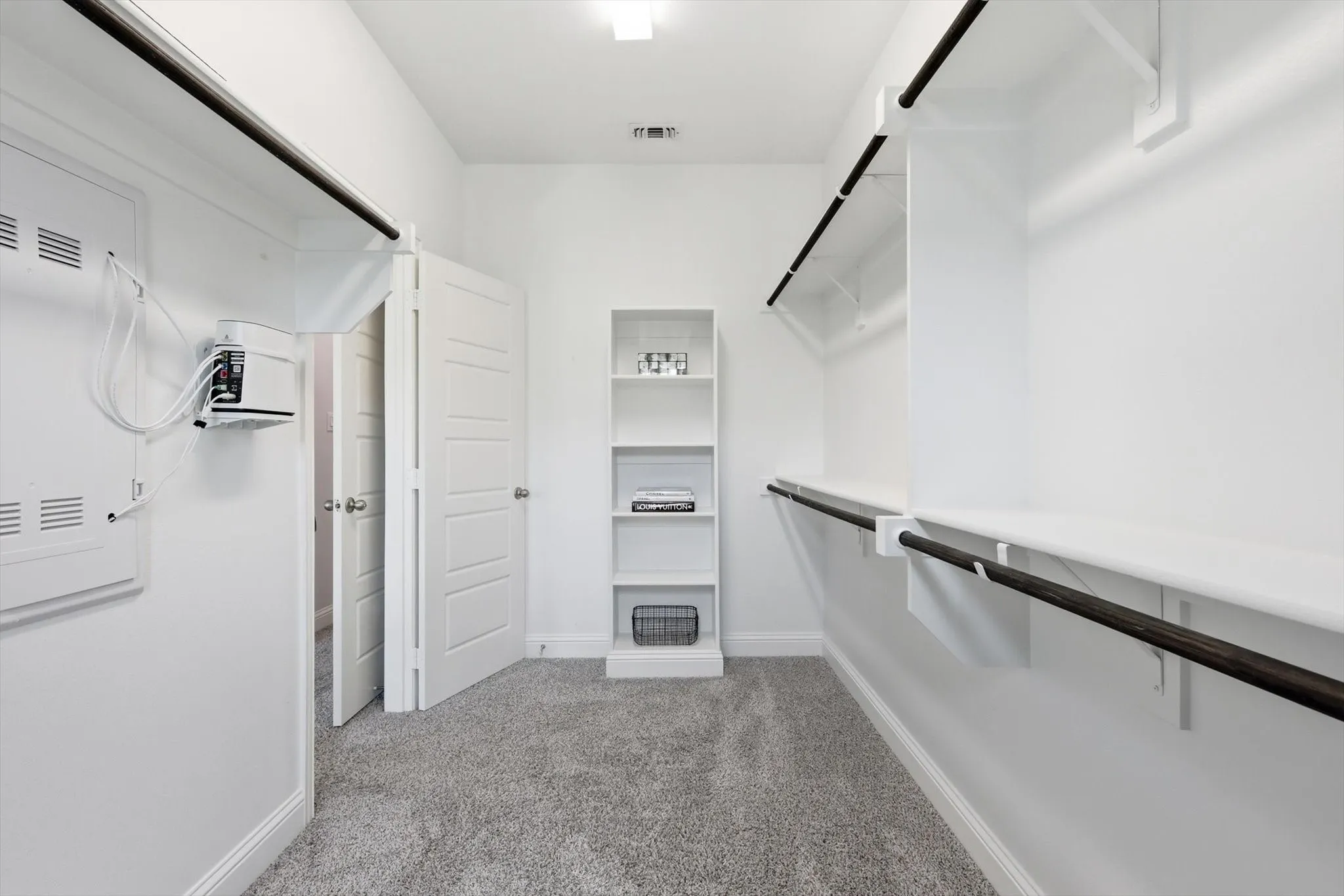 One of two walk-in closets in the primary bedroom