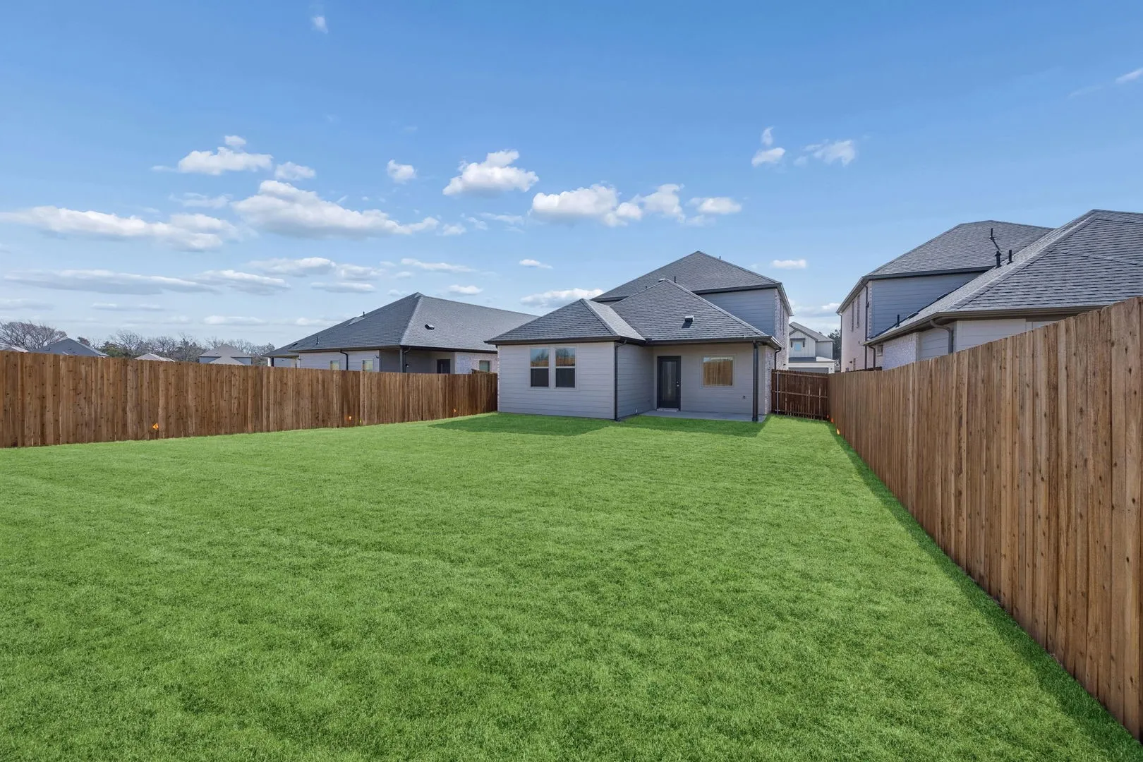 Covered Patio in the Oak II home plan by Trophy Signature Homes – REPRESENTATIVE PHOTO