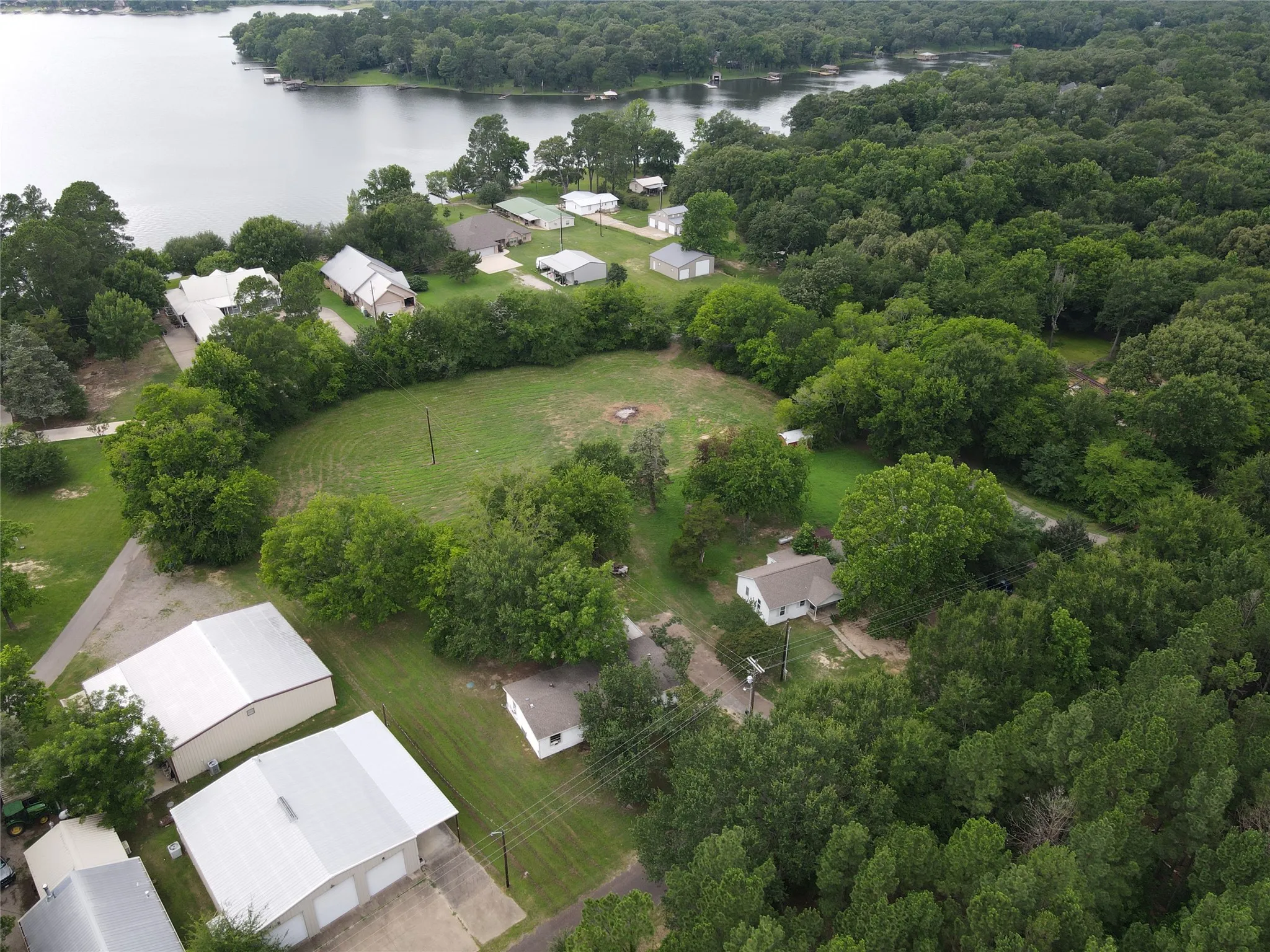 Lakeview property with mature trees and a manicured green space