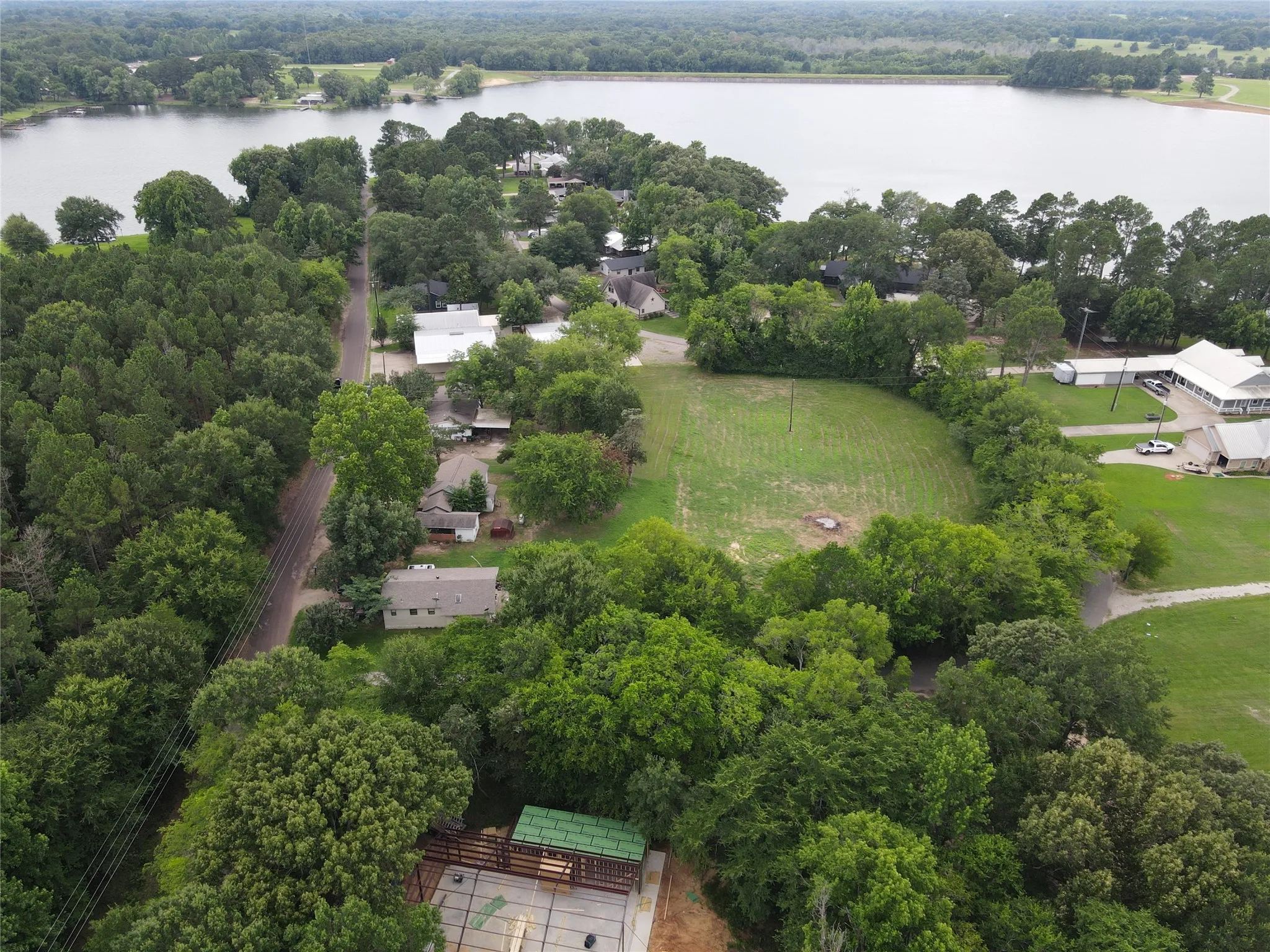 Lakeview setting with surrounding wooded areas and open green spaces