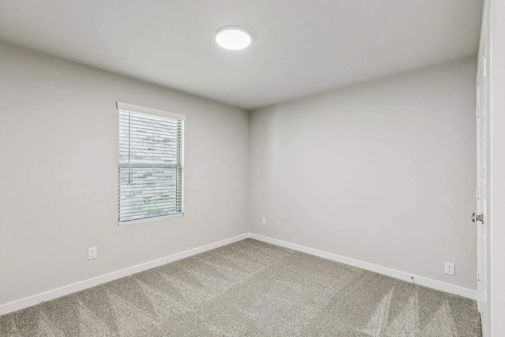 Bedroom in the Harper home plan by Trophy Signature Homes – REPRESENTATIVE PHOTO