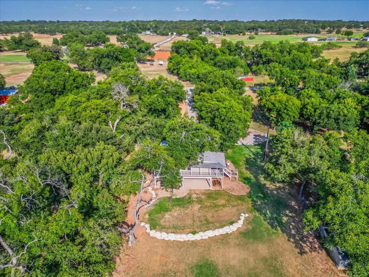 Expansive aerial view showcasing the property and surrounding Brazos River setting