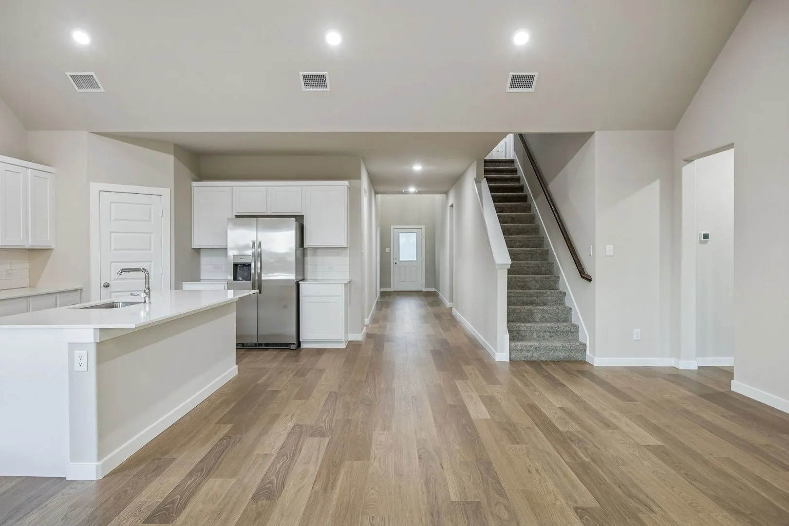 Open First Floor in the Wimbledon home plan by Trophy Signature Homes – REPRESENTATIVE PHOTO