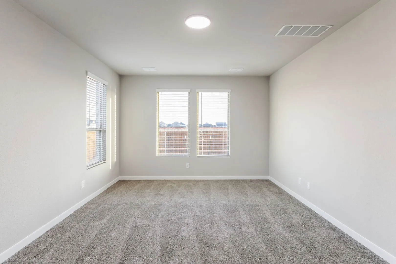 Primary Suite in the Wimbledon home plan by Trophy Signature Homes – REPRESENTATIVE PHOTO