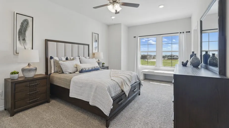 Recessed lighting, ceiling fan, carpet flooring, dual pane windows, and a window bench
