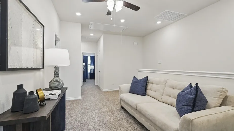 Recessed lighting, ceiling fan, carpet flooring, and a half-height wall
