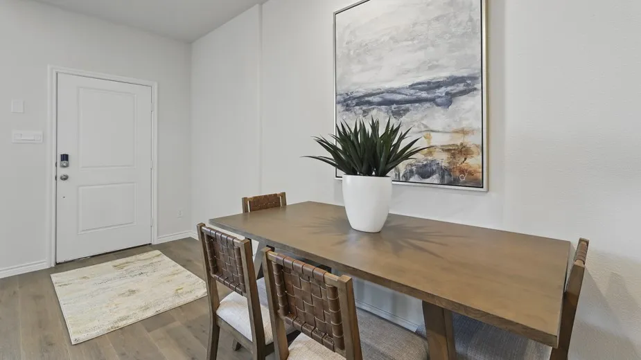 Wood-finish flooring with a white paneled door