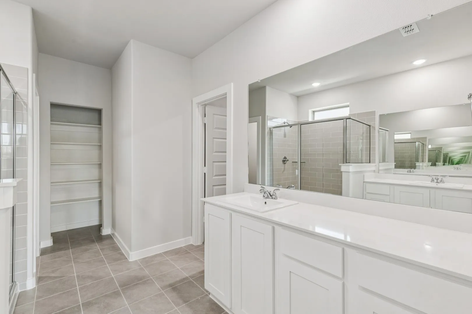 Primary Bathroom in the Winters home plan by Trophy Signature Homes – REPRESENTATIVE PHOTO