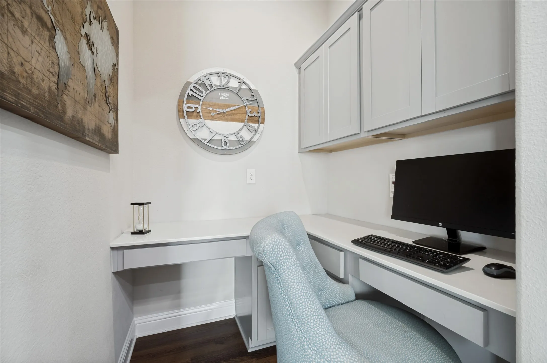 Convenient built-in workspace featuring generous desk space, overhead cabinetry, and plenty of storage—perfect for a home office, homework station, or everyday organization.