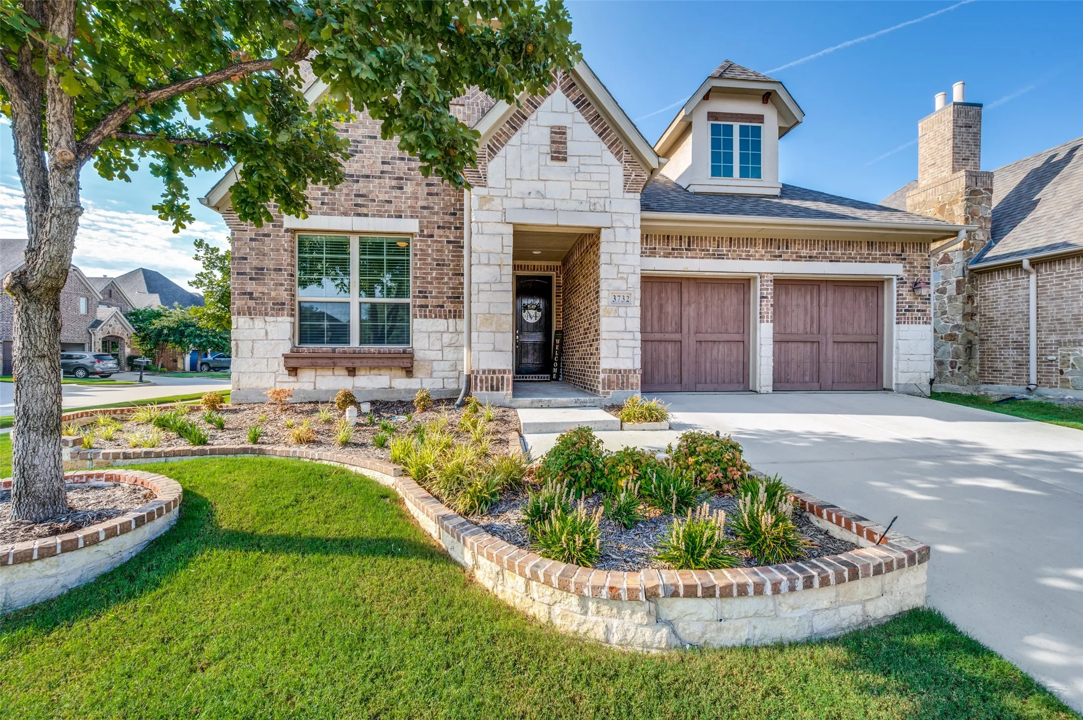 Situated on a desirable corner lot, this charming 3-bedroom, 2-bath home offers beautiful curb appeal with a brick and stone exterior, mature shade trees, manicured landscaping, and a two-car garage. The thoughtfully designed floor plan provides comfortable living spaces with plenty of natural light, making this home perfect for everyday living and entertaining.