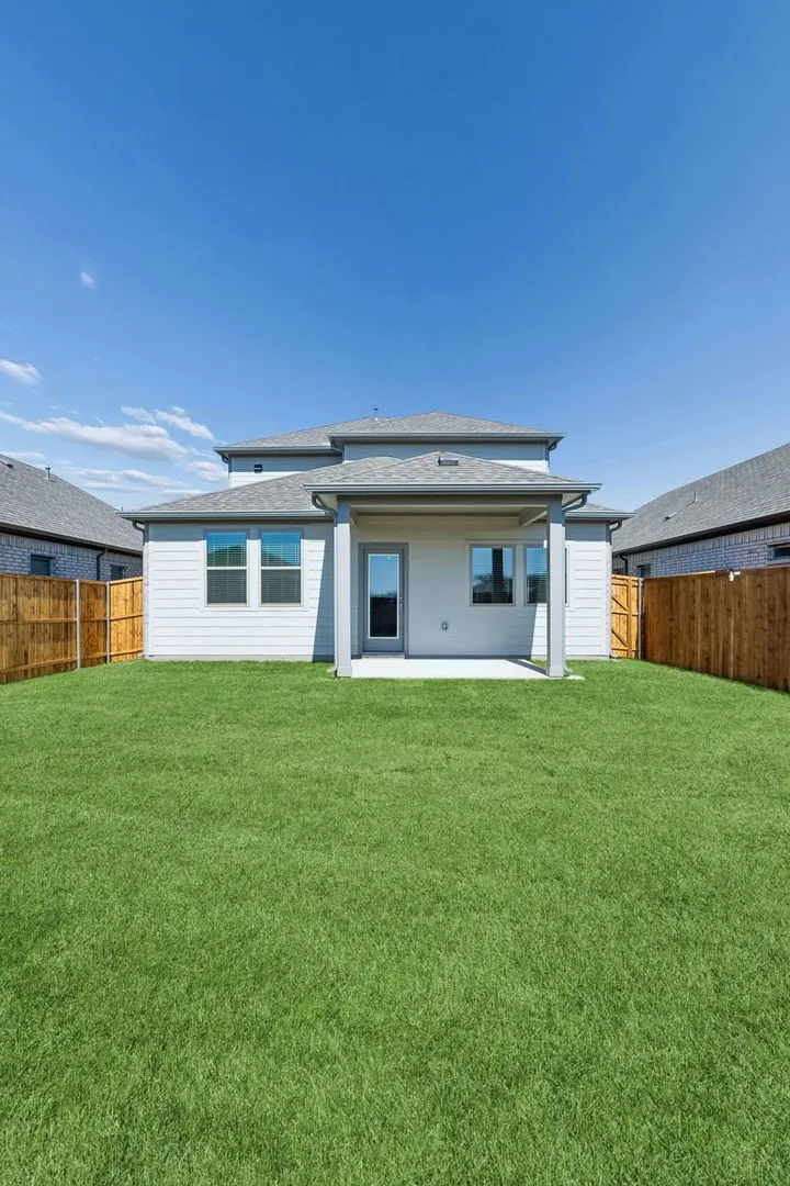 Covered Patio in the Mesquite home plan by Trophy Signature Homes – REPRESENTATIVE PHOTO