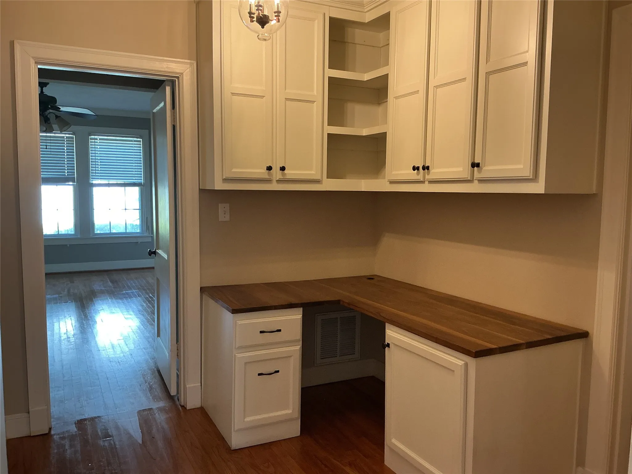 Office is located on the first floor between kitchen and Primary Bath