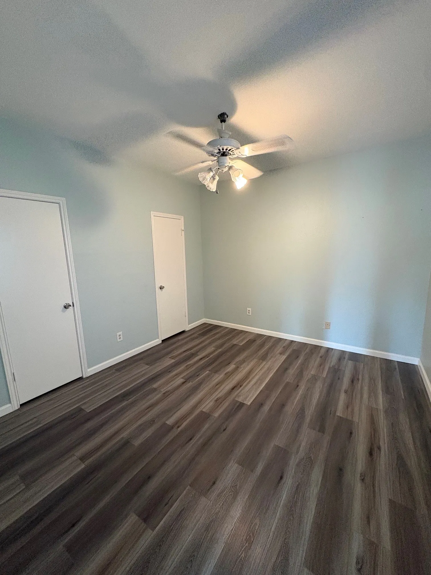 Bedroom with ceiling fan.