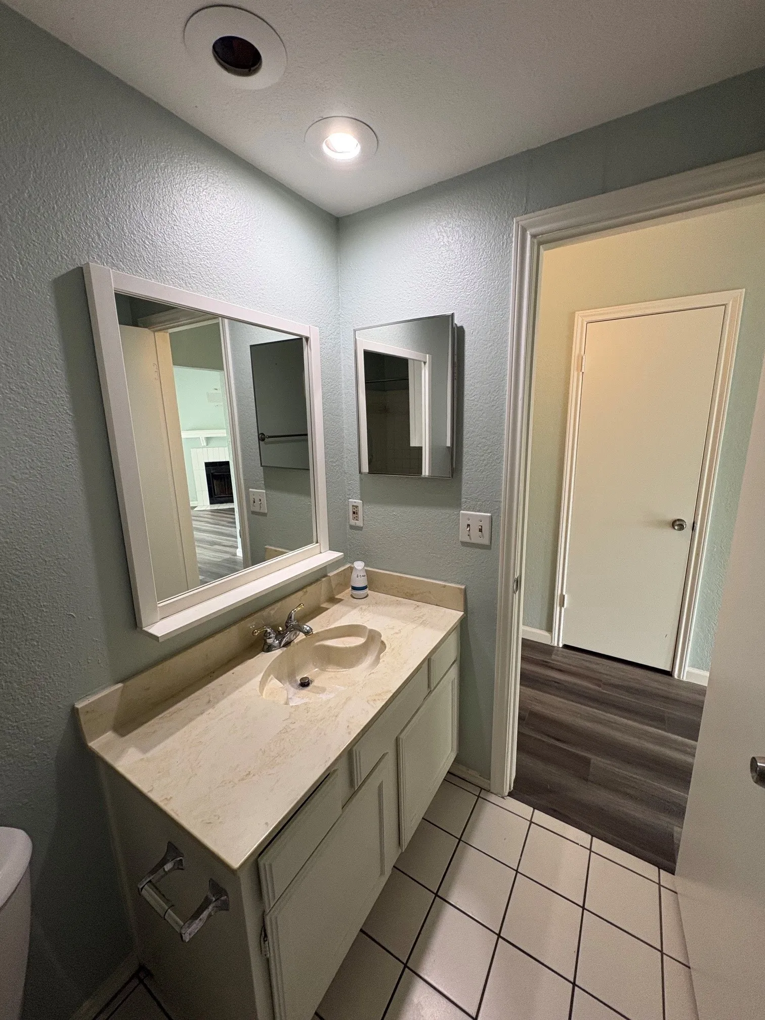 One bathroom with ceramic tile floor.
