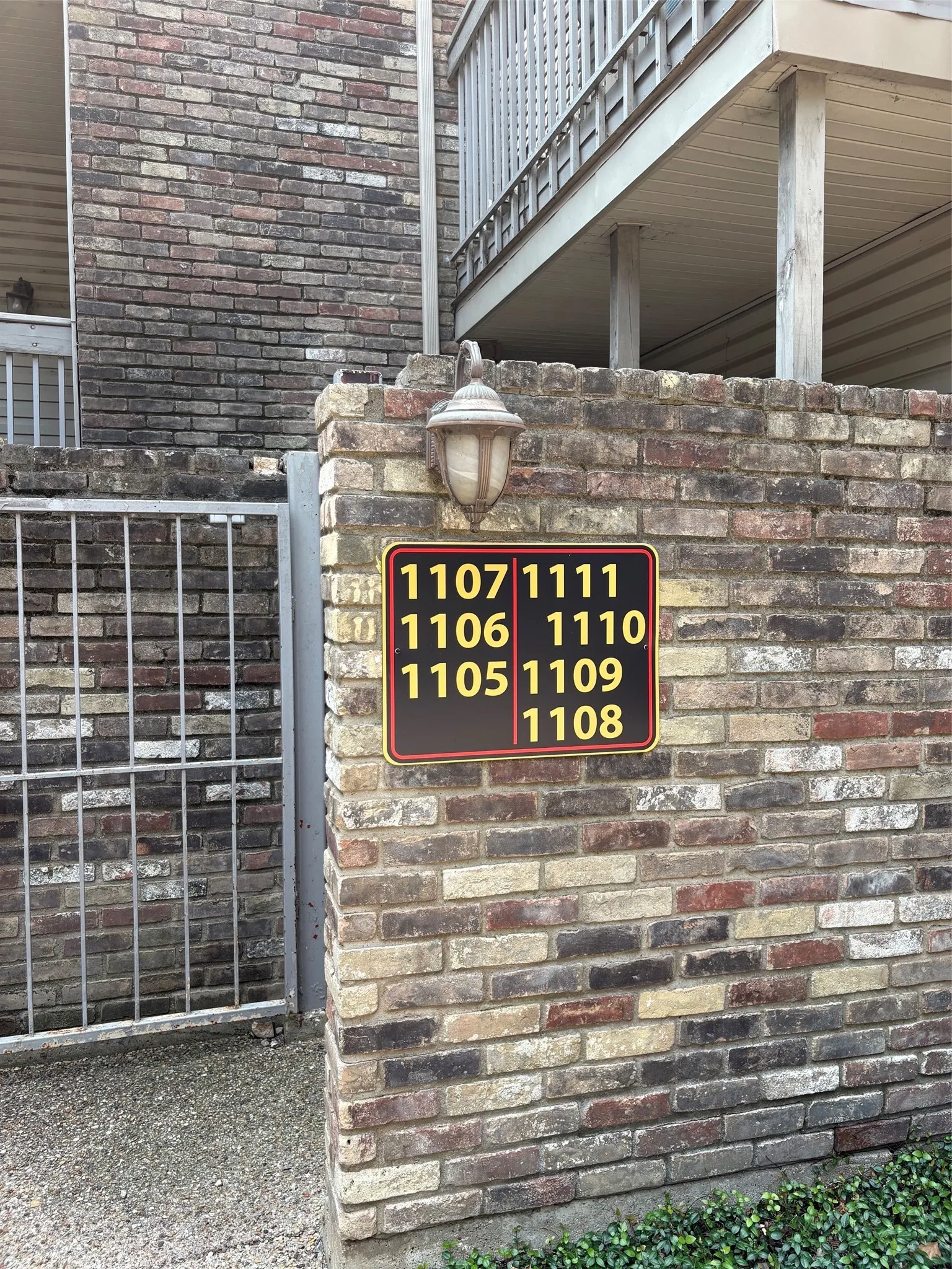 Building 11 - Sign with unit numbers.