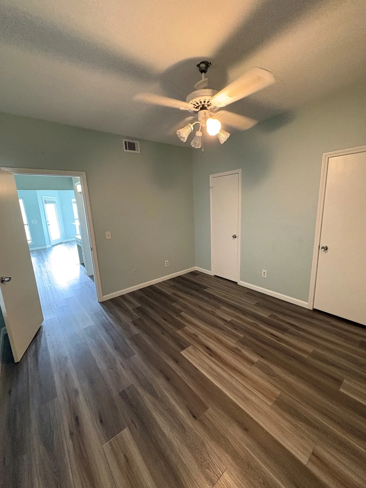 One bedroom with laminate flooring.