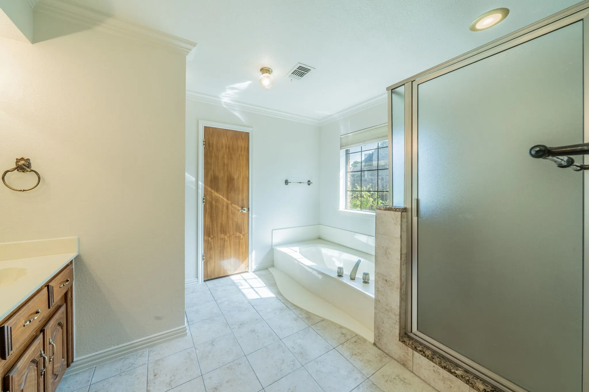 Bathroom has separate tub and shower.  Shower has been updated