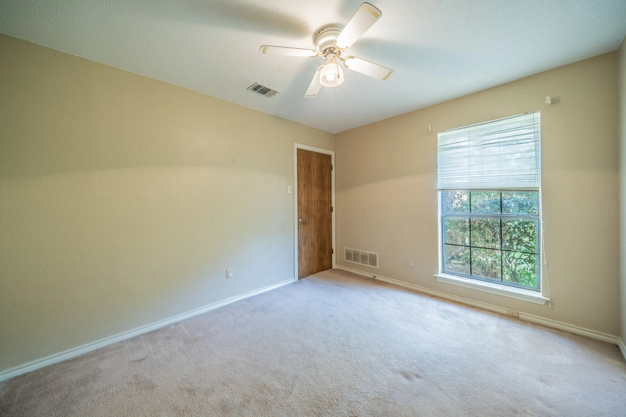 The two secondary bedrooms are down a hallway from the entry opposite the family room.  Privacy for the family.