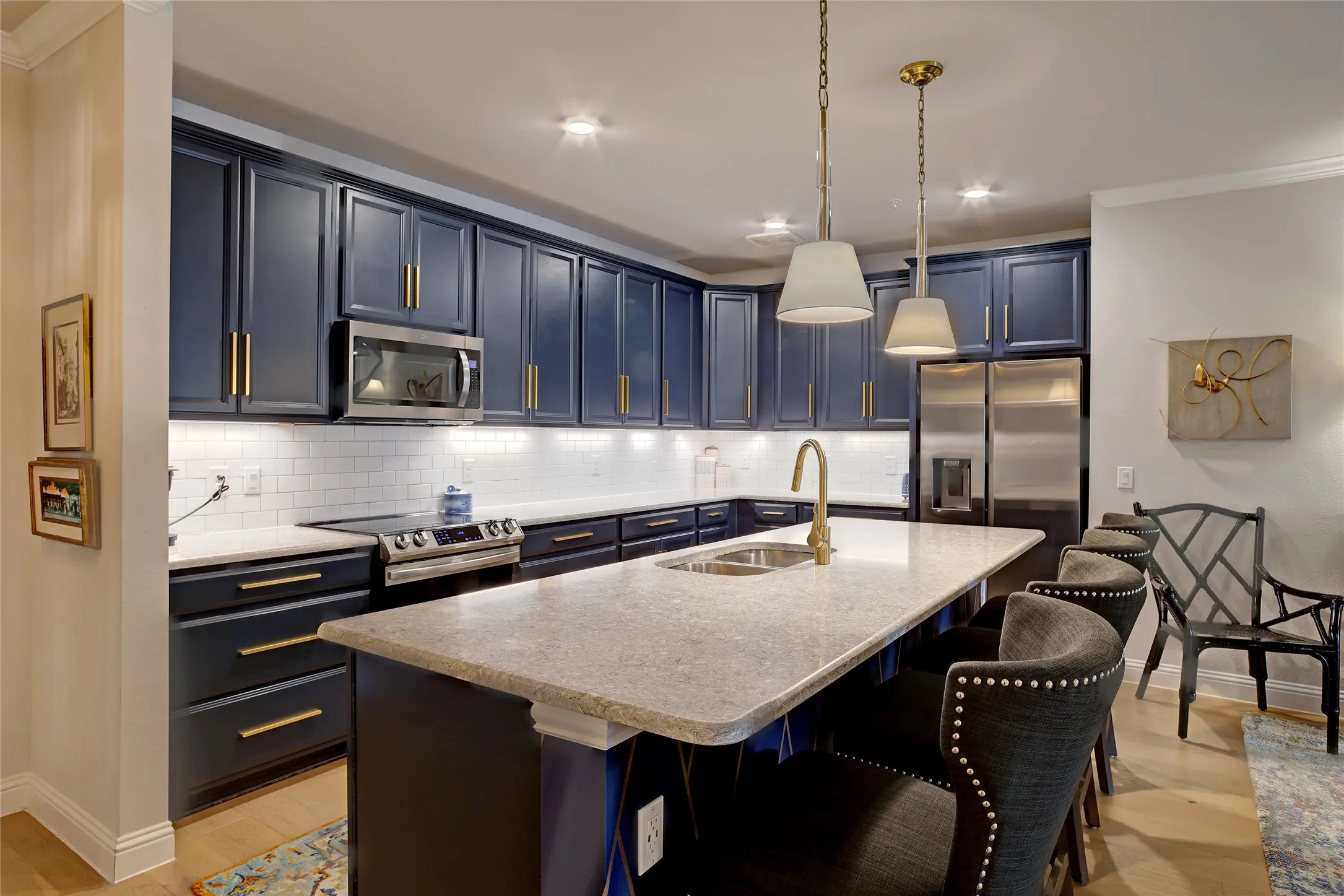 42" cabinets, yards of granite, upgraded appliances, accent lighting and pulls