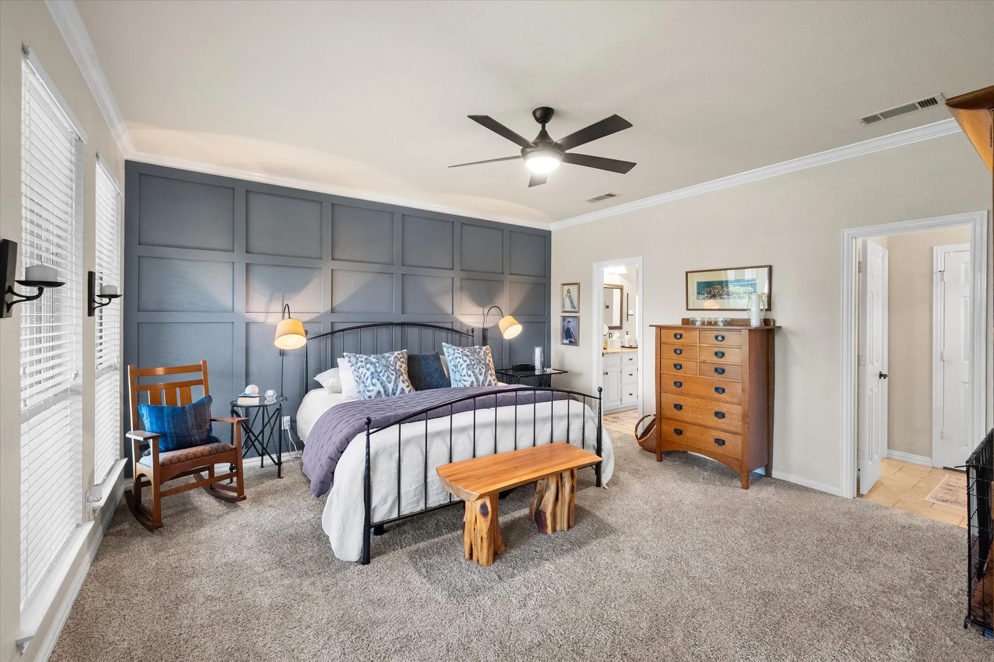 Large primary bedroom. with custom accent wall
