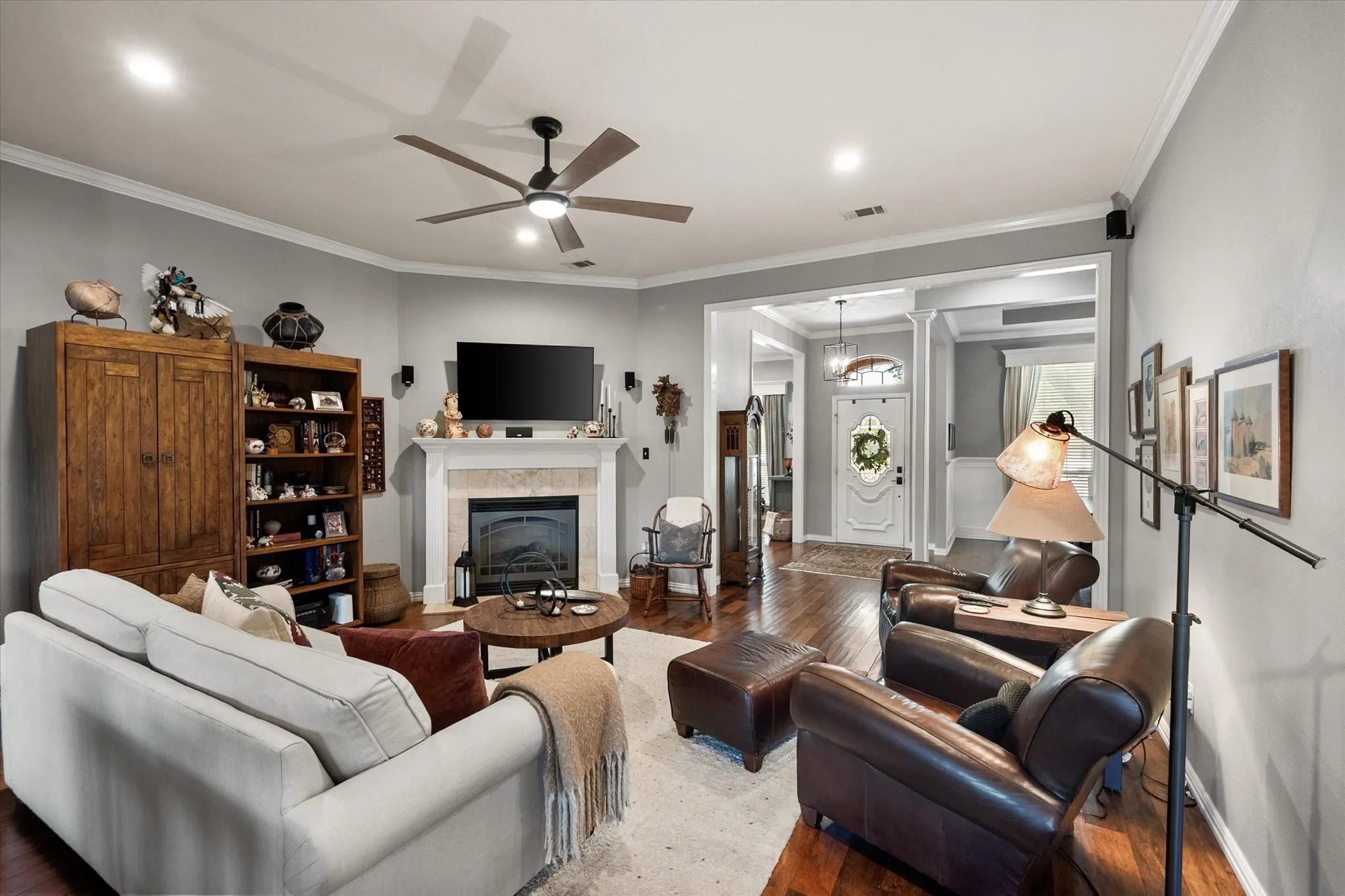 Family room features a fireplace with gas logs