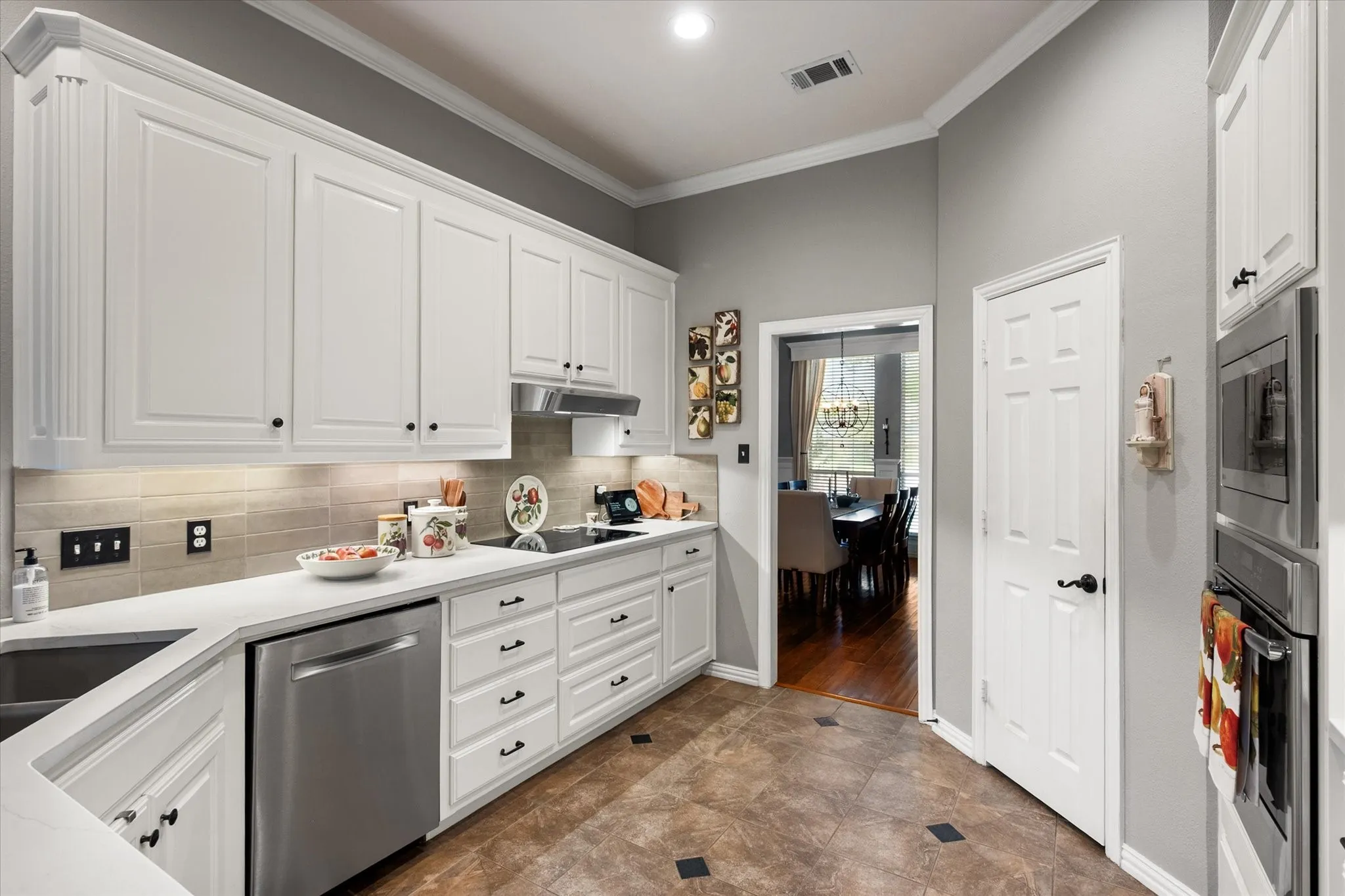Honed-leathered quartz countertops and stainless applliances