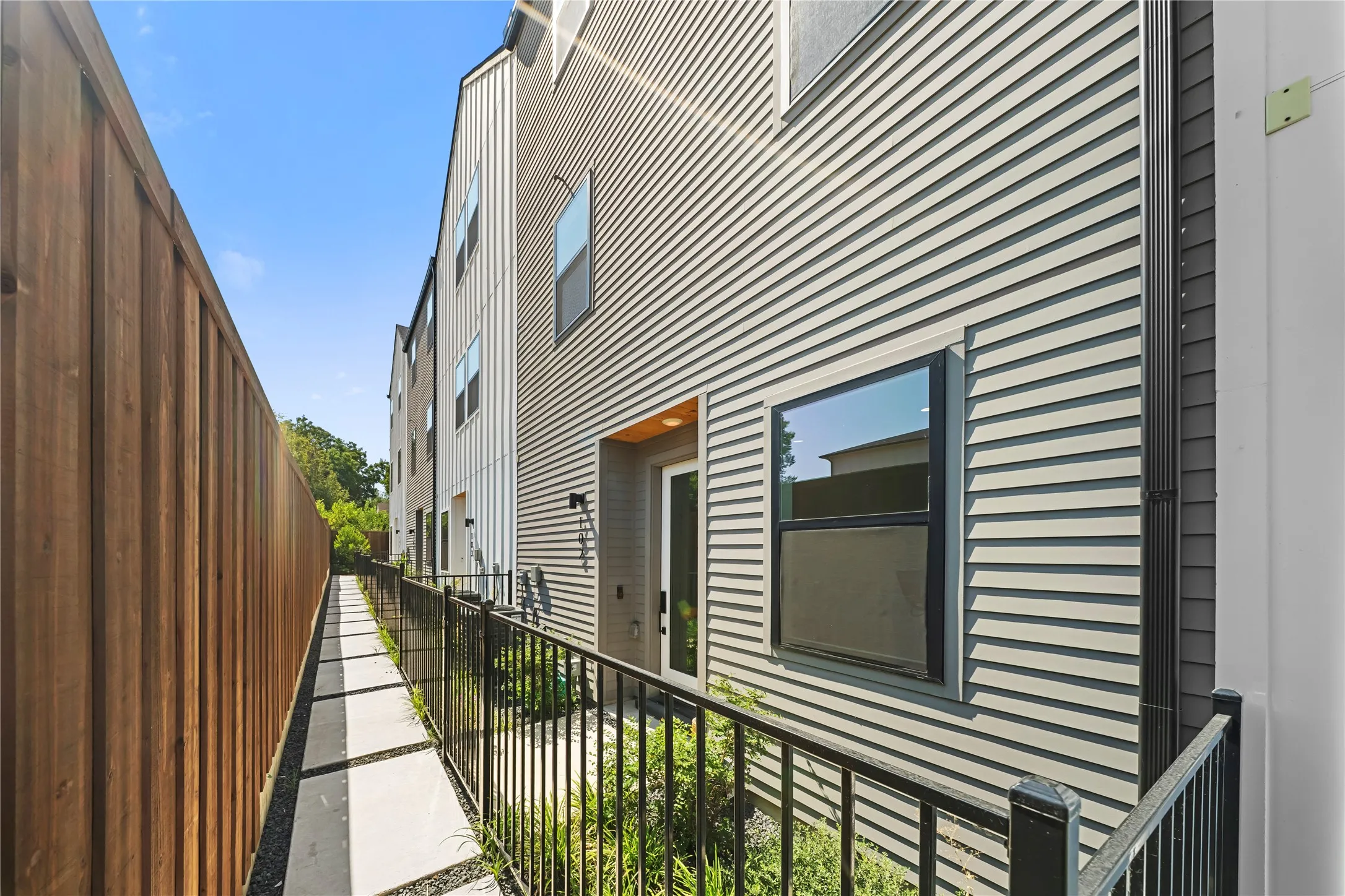 Exterior siding in a light gray horizontal pattern