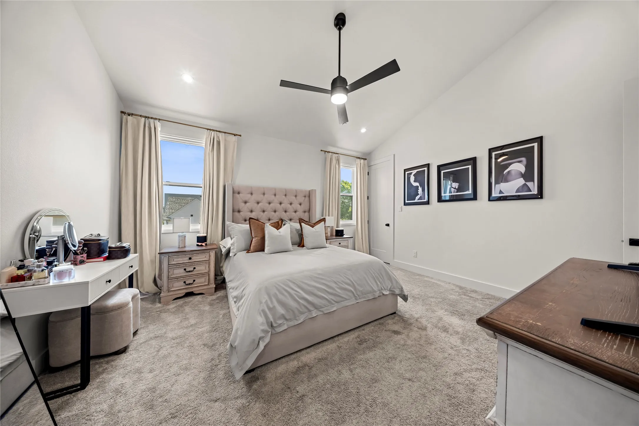 Vaulted ceiling with a ceiling fan, recessed lighting, and wall-to-wall carpeting