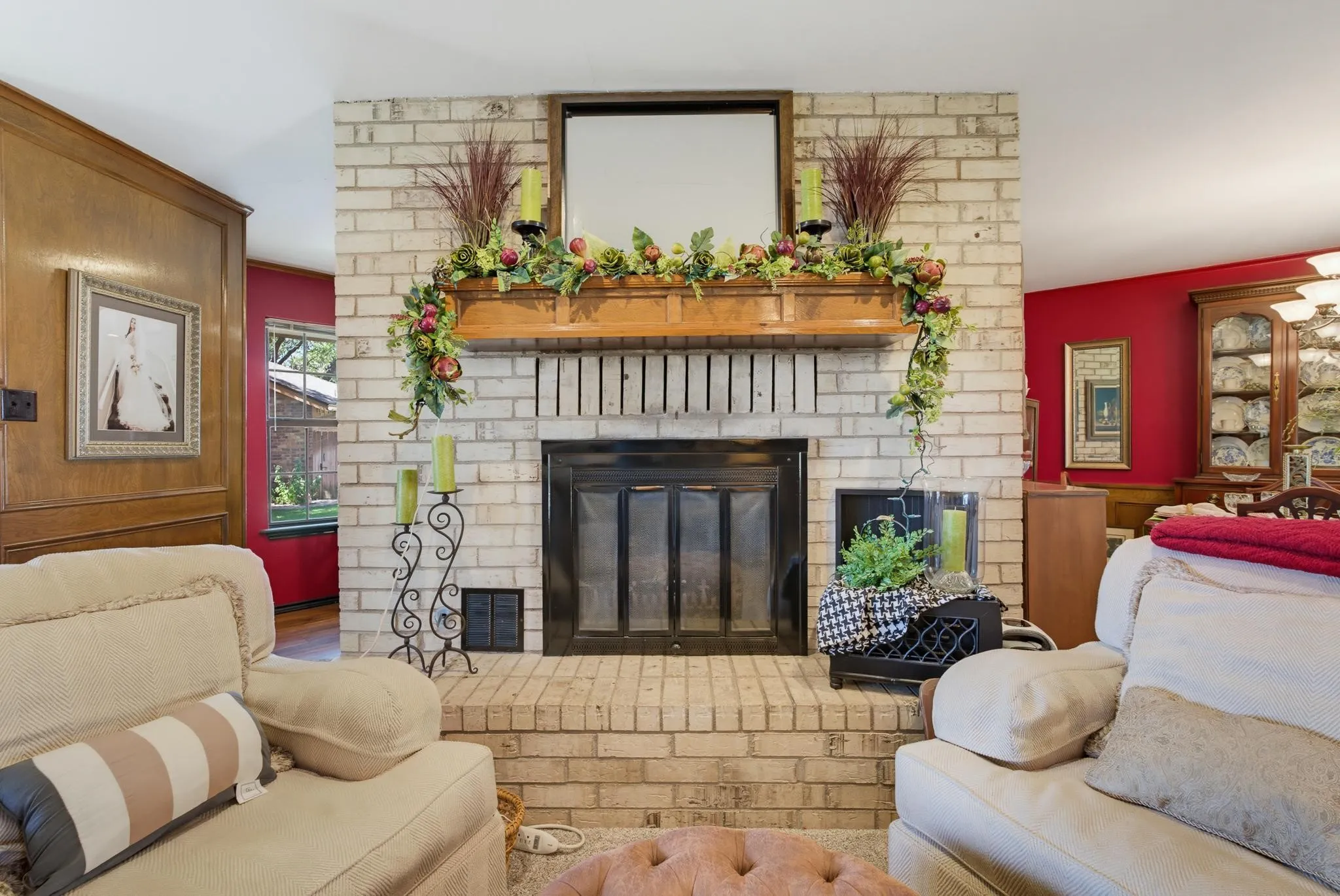 Brick-faced fireplace with a wood mantel
