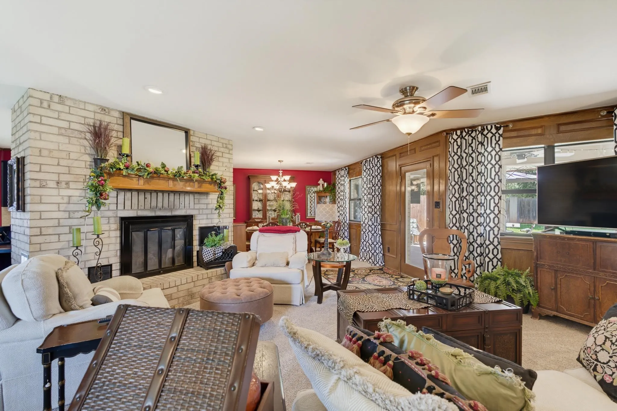 Brick fireplace with a wood mantel