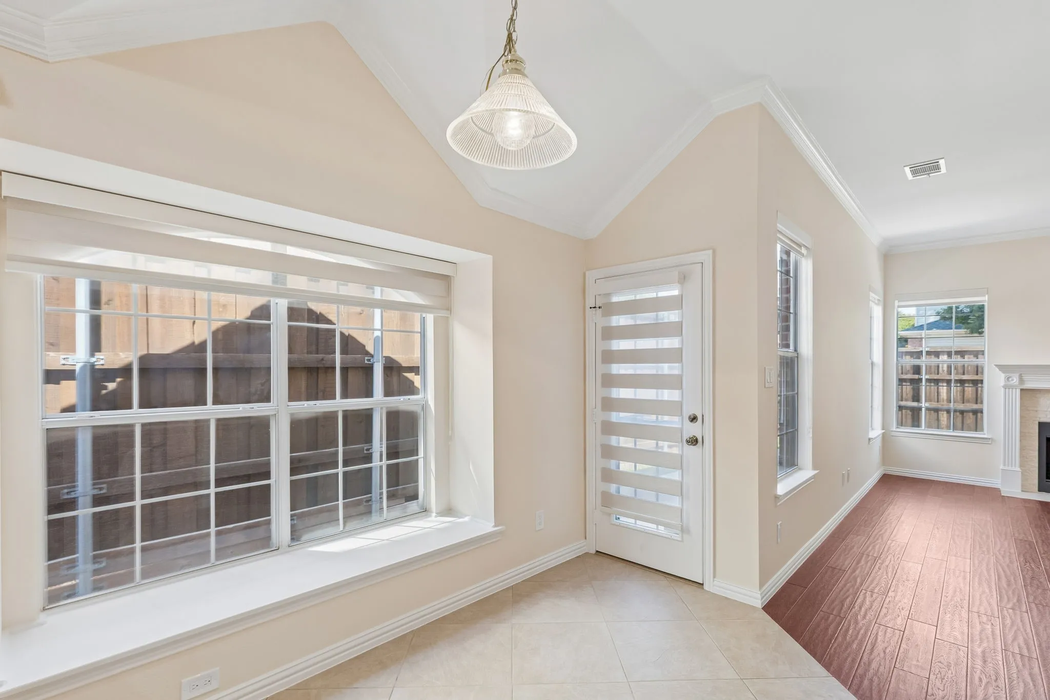 Vaulted ceiling with crown molding, window seat window