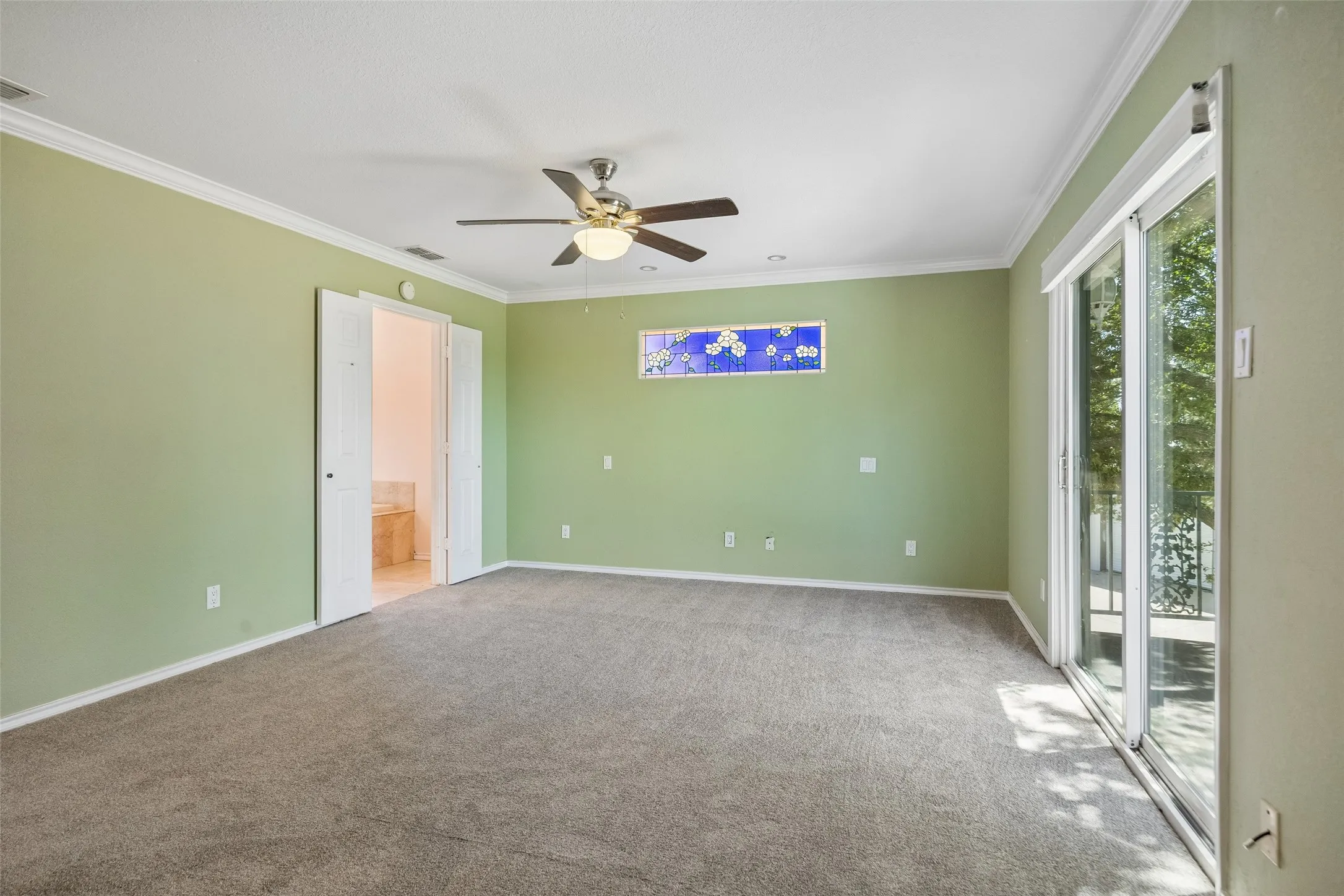 Second floor Primary bedroom Sliding glass door opening to a balcony with over looking stunning views