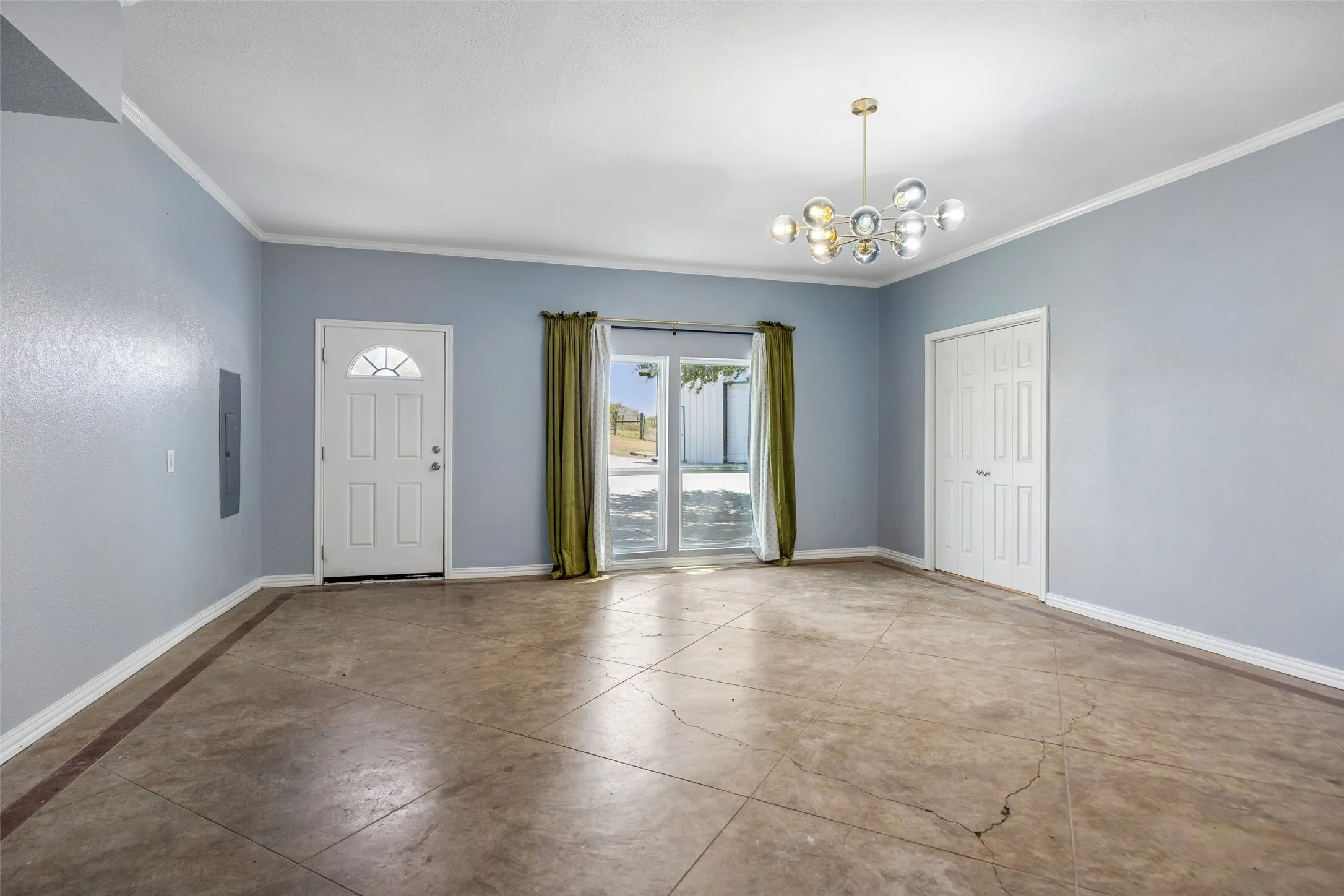 2 car garage was converted to second living area.   Features White paneled front door with an arched window