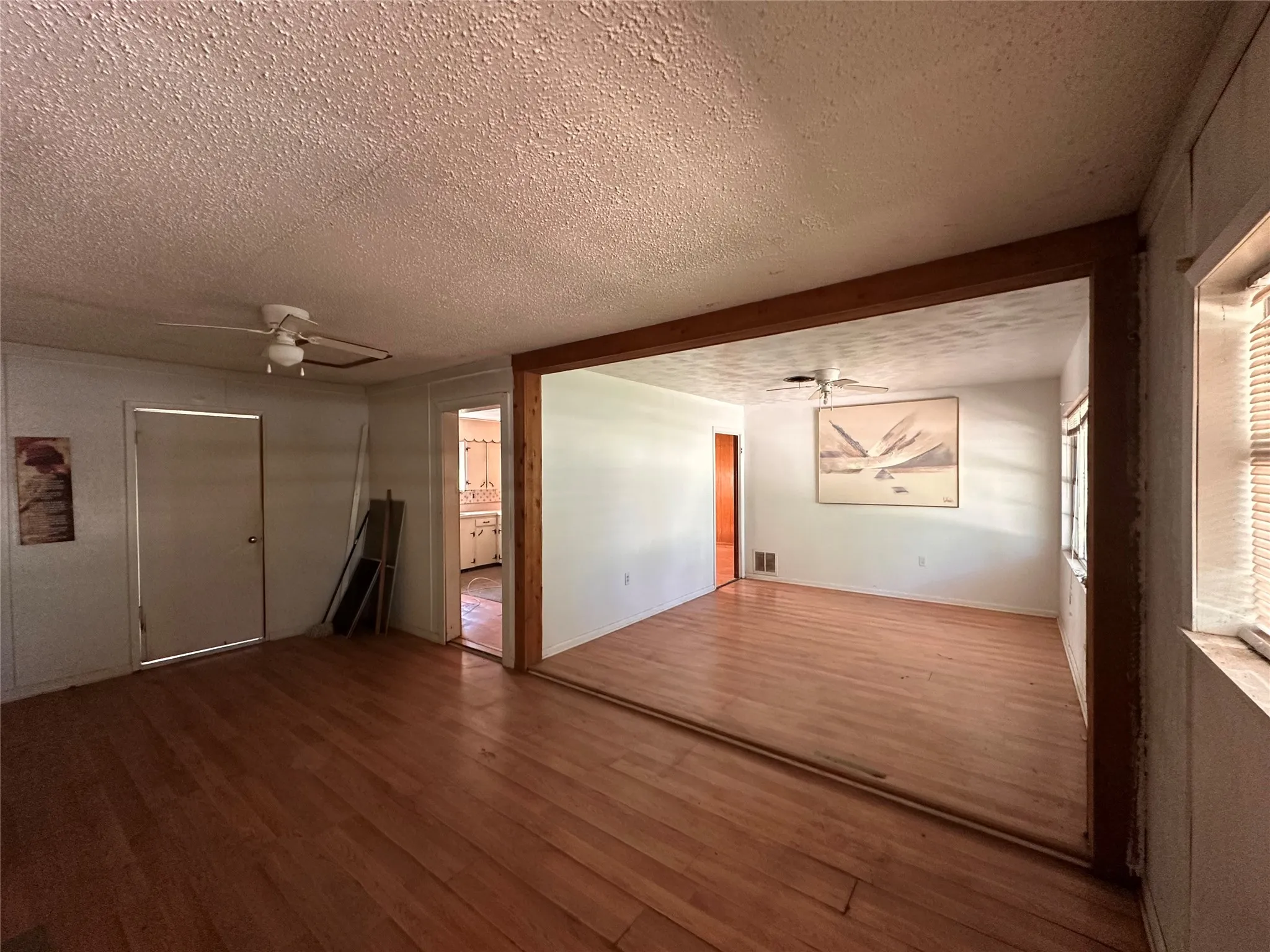 ceiling fan, and window with horizontal blinds