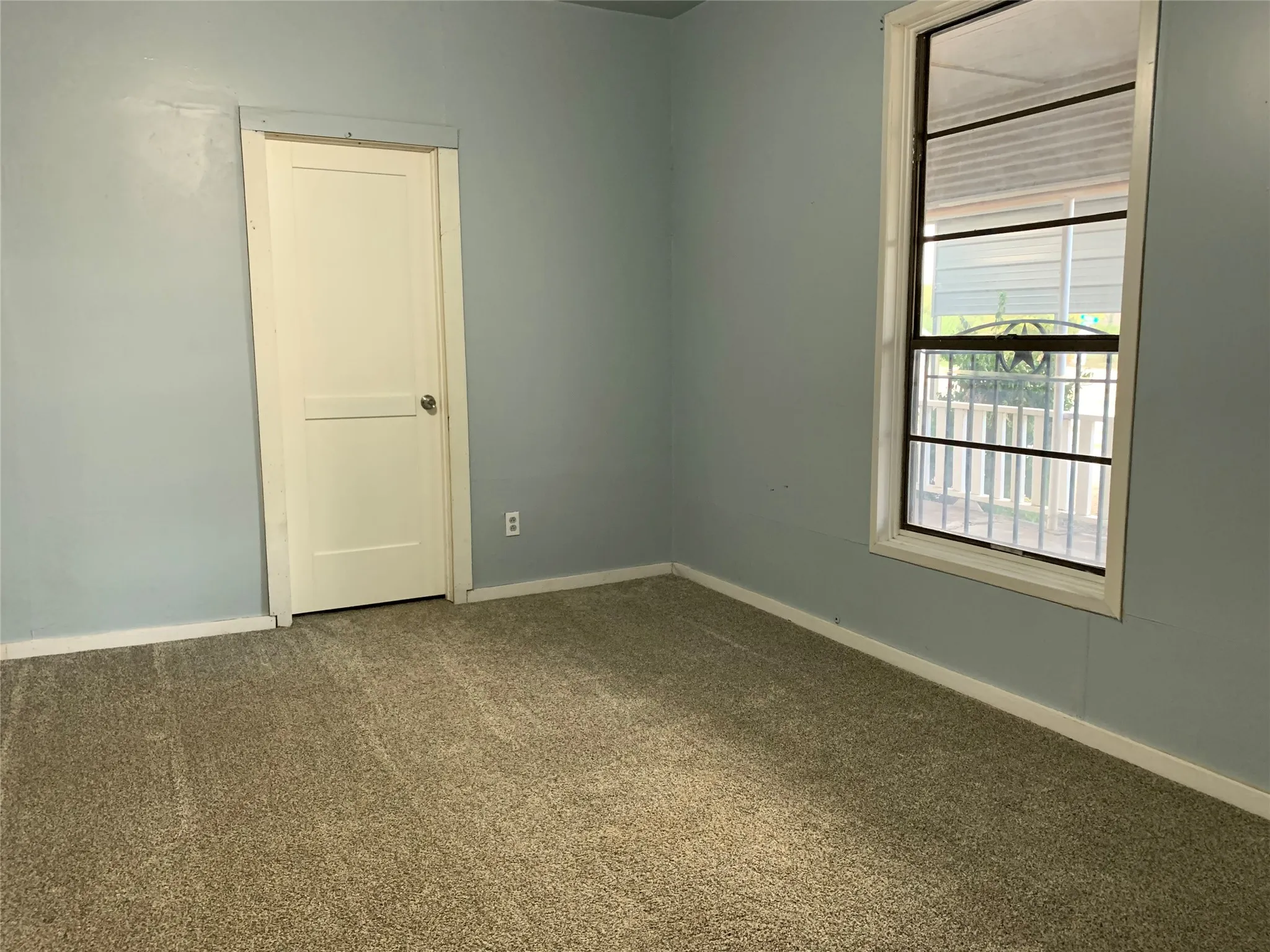 First Bedroom with view out to front porch. This room has an en-suite bathroom.