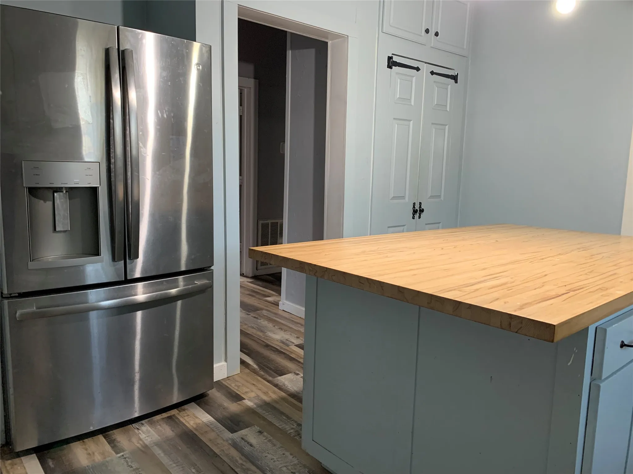 Refrigerator conveys with the sale of the property.