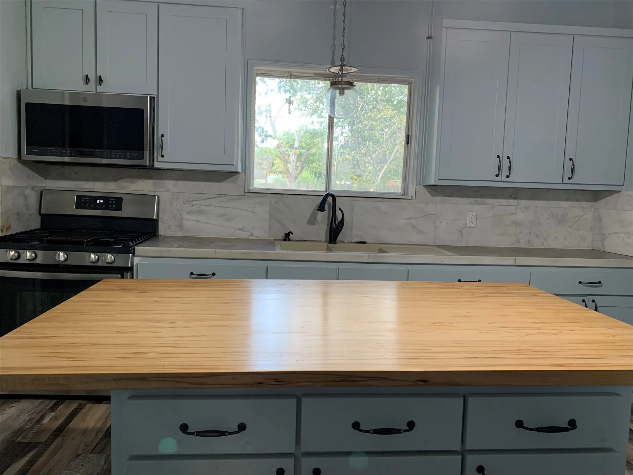 Large built in Island with storage. Range with built in micro wave above.