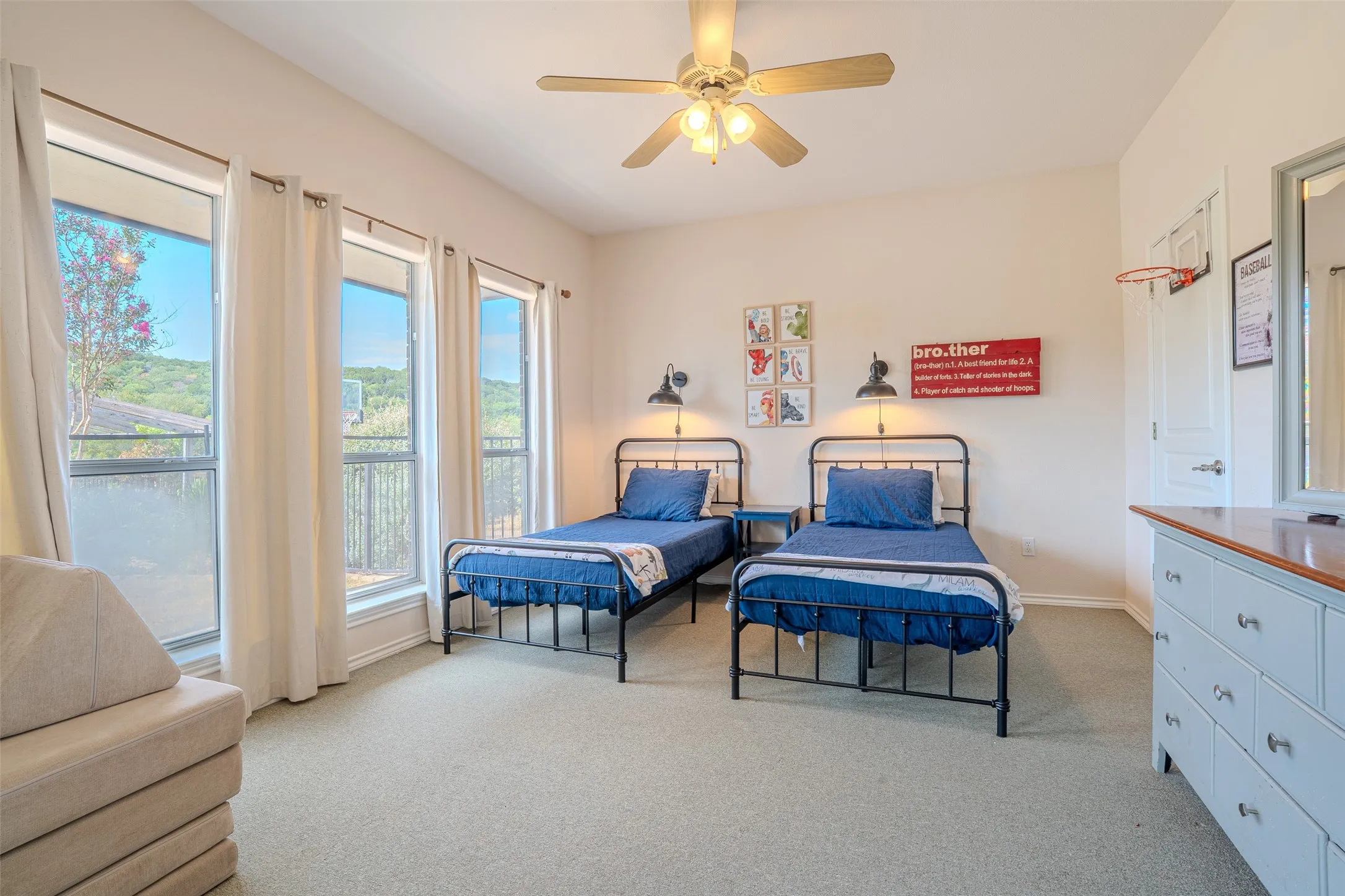 Recessed lighting, ceiling fan, multiple windows, soft carpet, and wall sconces