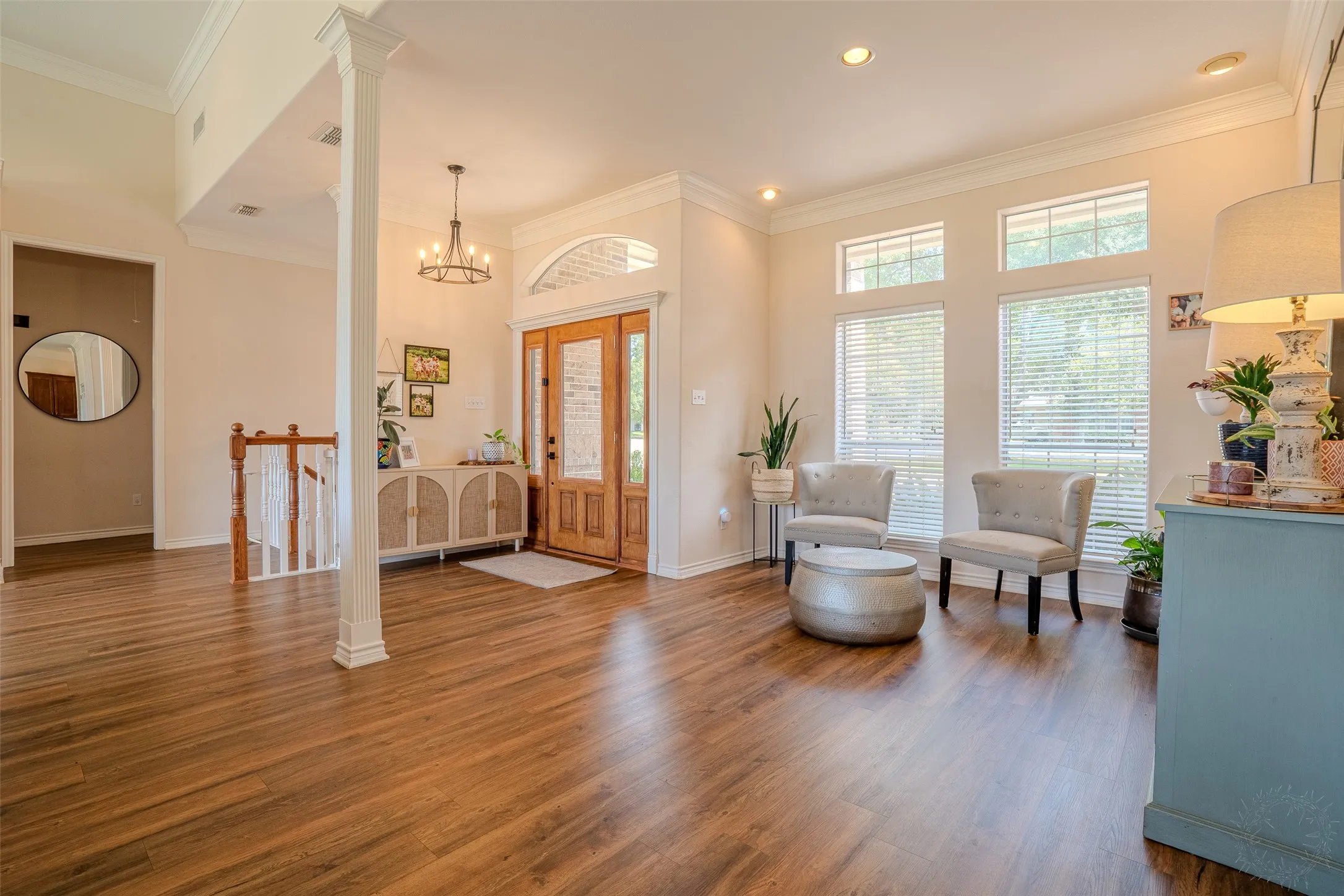 Wood-finish flooring throughout, complemented by a prominent white column