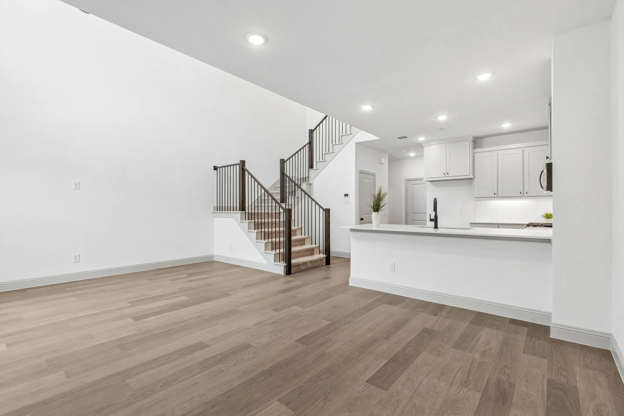 Metal railing on your new staircase continues the open and airy feeling upstairs.