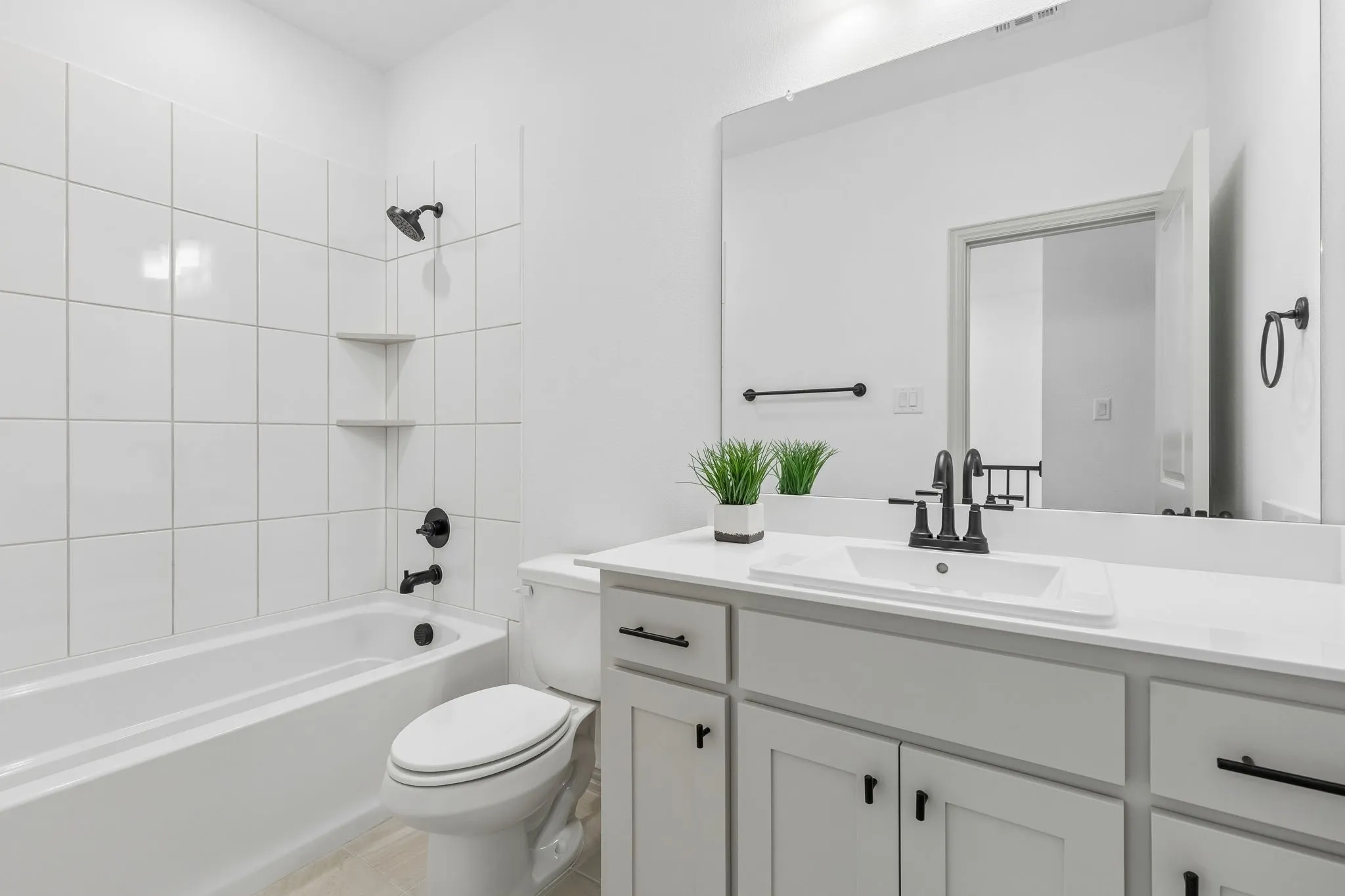 Friends and family will feel right at home in the lovely guest bath in our Conley plan.