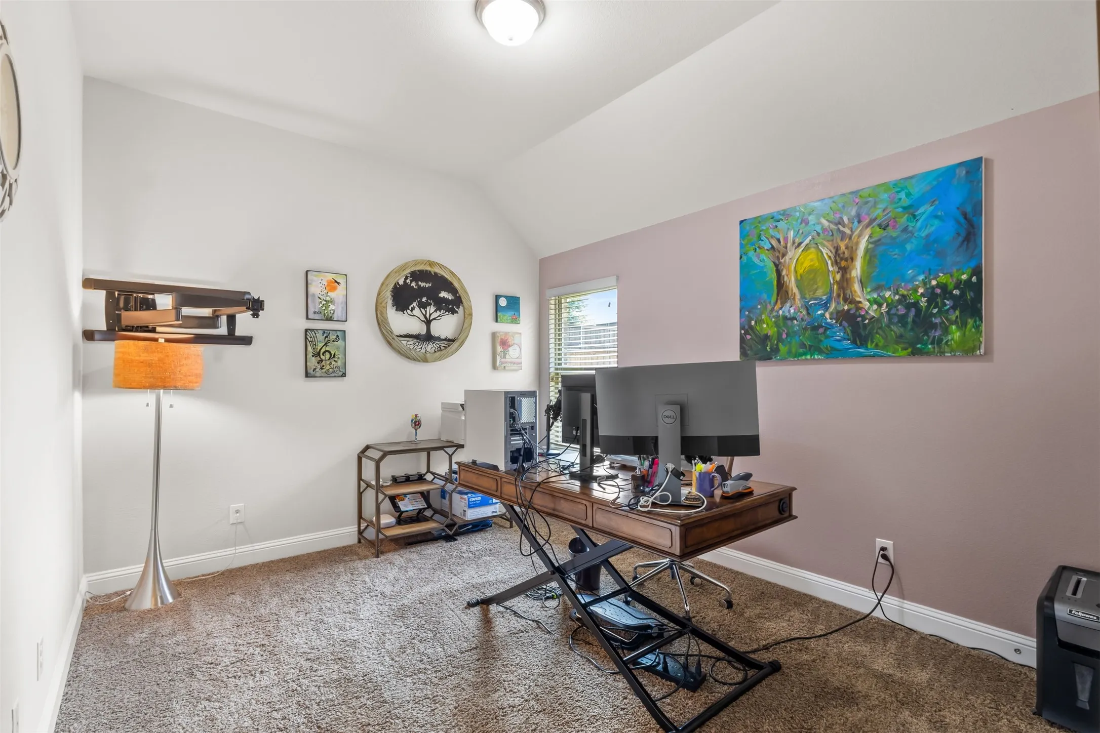 Vaulted ceiling, recessed lighting, window with blinds, and two-tone wall finishes