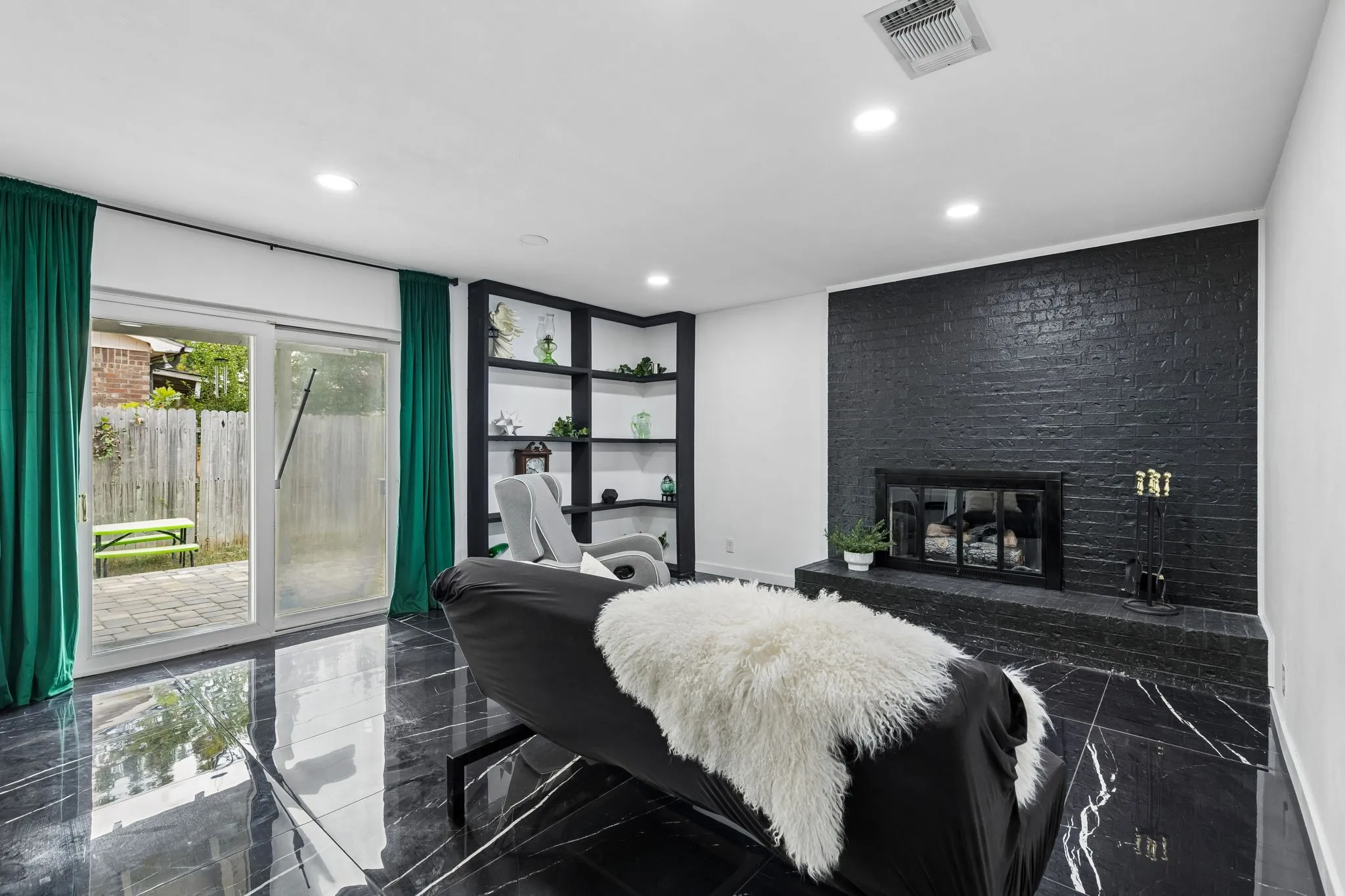Second living area off kitchen with propane fireplace perfect for a night in!