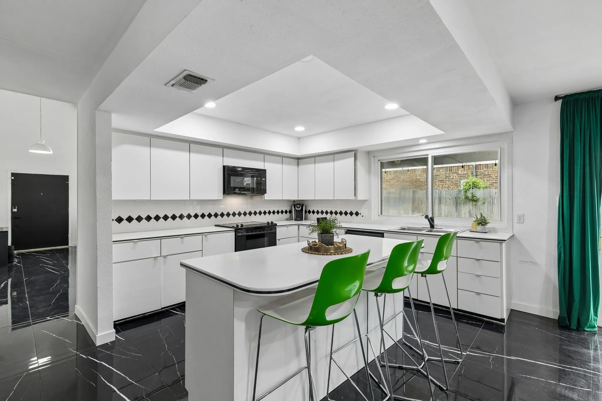 Large kitchen island perfect and lots of counter space in this kitchen!