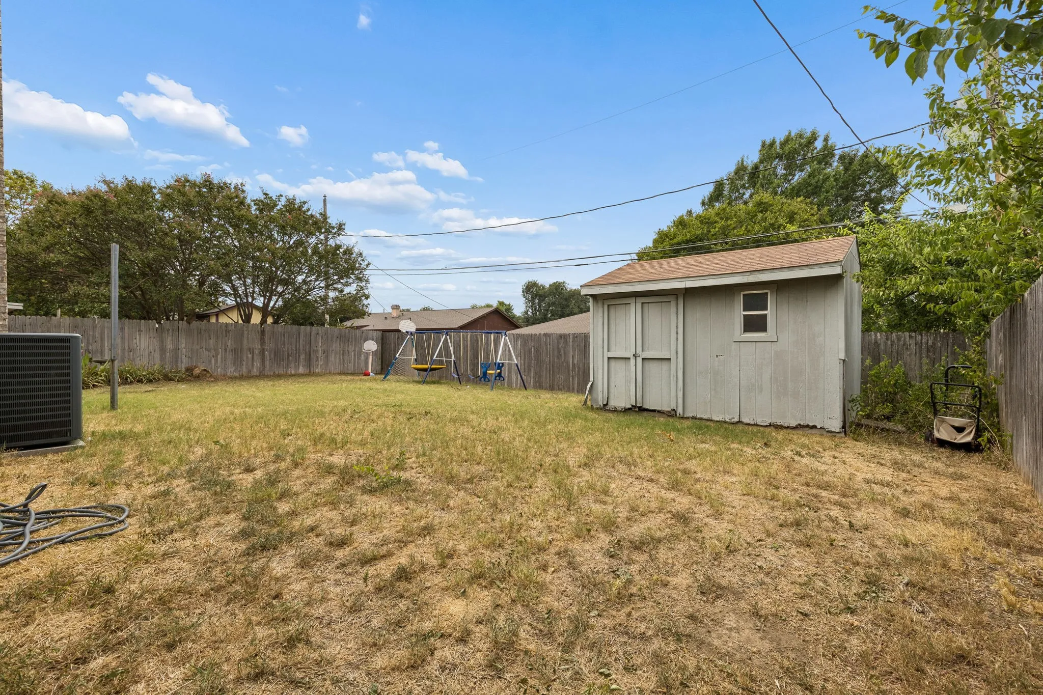 Spacious backyard with shed