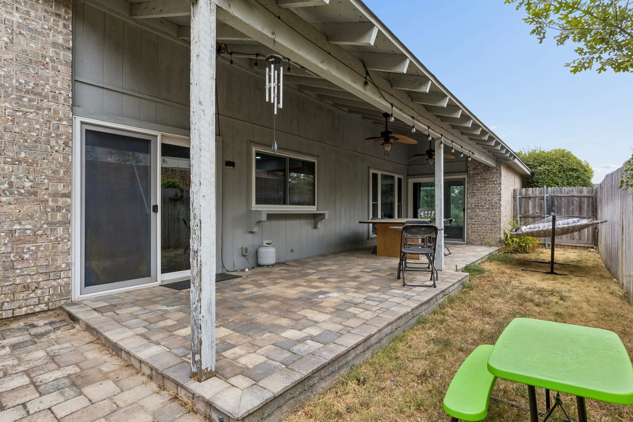 Large covered patio with access from both living rooms!