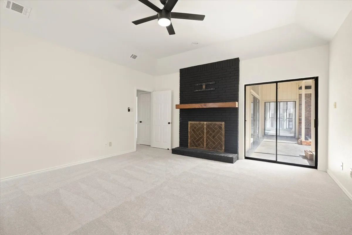 Primary bedroom with wood burning fireplace
