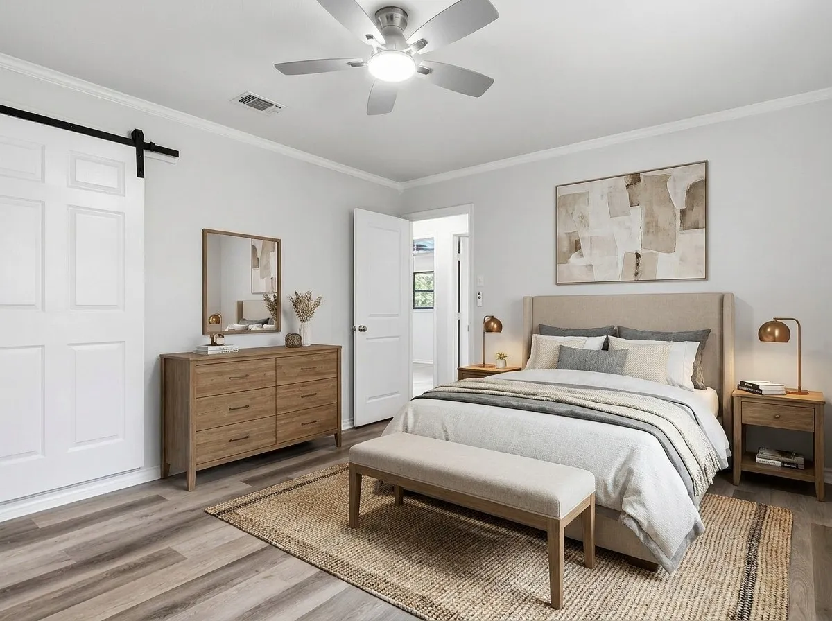 Virtually staged Main Br. Has a barn door to the main bath.