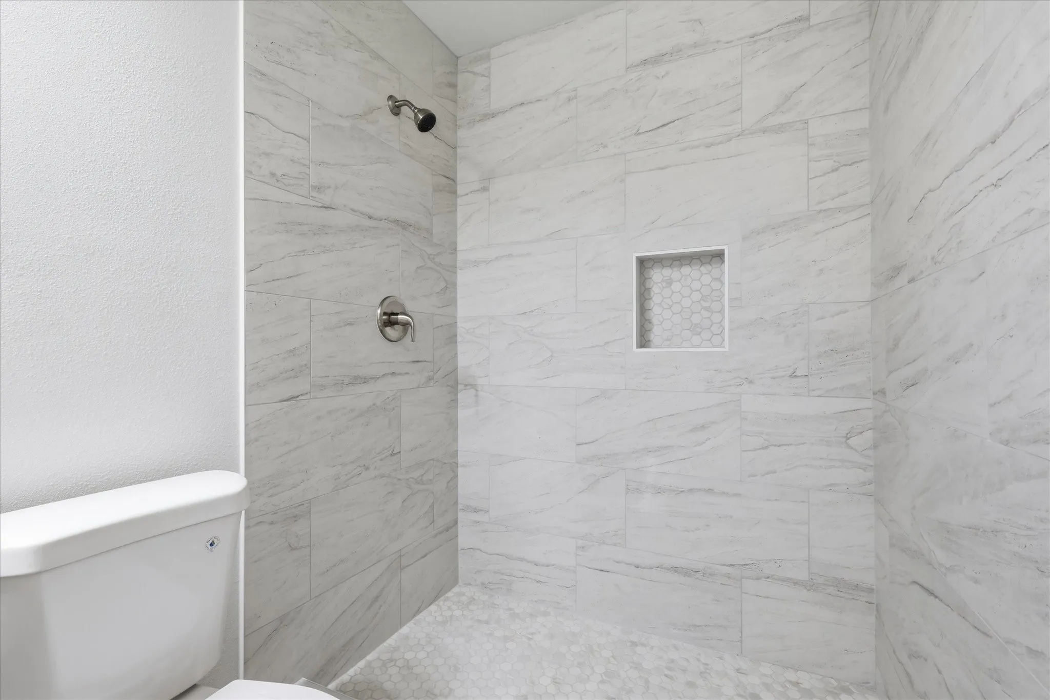 Main bath has granite tops, new cabinets & large walk-in shower.