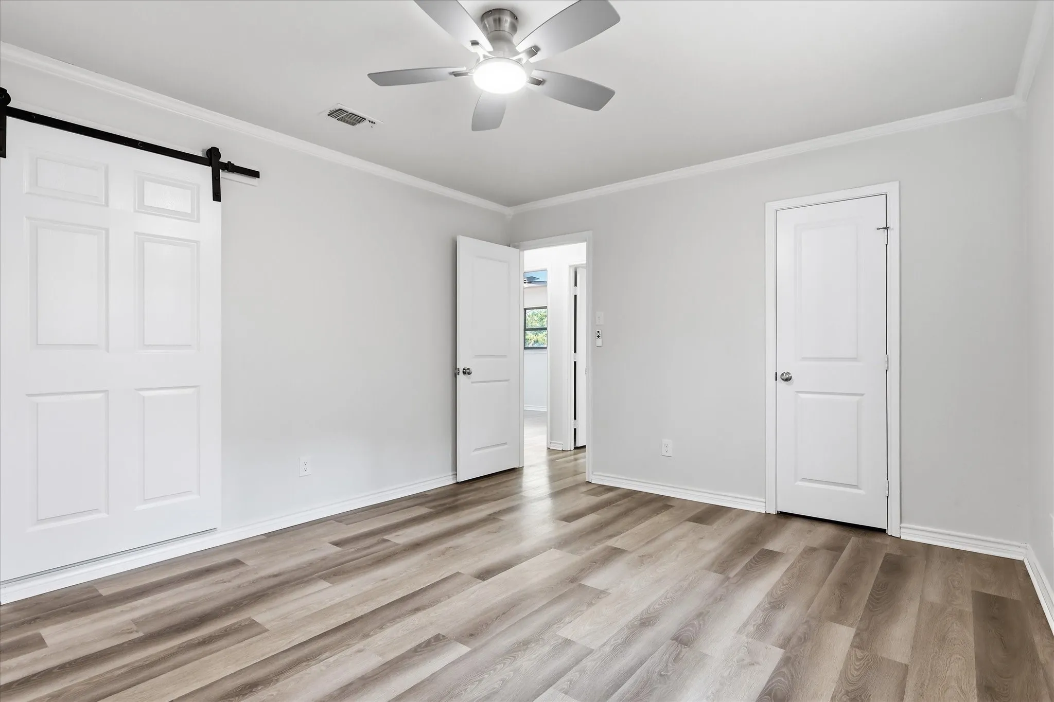 Main Br has a sliding barn door to the bathroom.